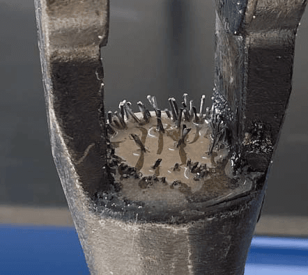 Fully cured socket condition showing encapsulated broomed steel strands within the socket cavity.